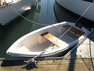Small dinghy beside the boat