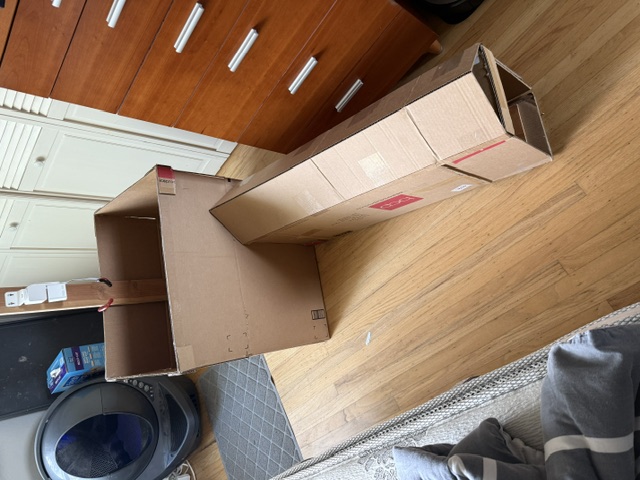 Weight-sensitive cat food access limiter built from cardboard and wood